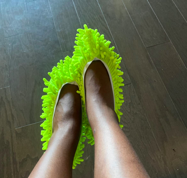 A customer review image of them wearing the slippers, showing off how they work