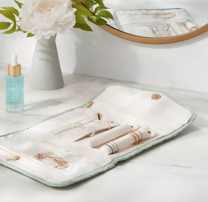 The unfolded pale green organizer.
