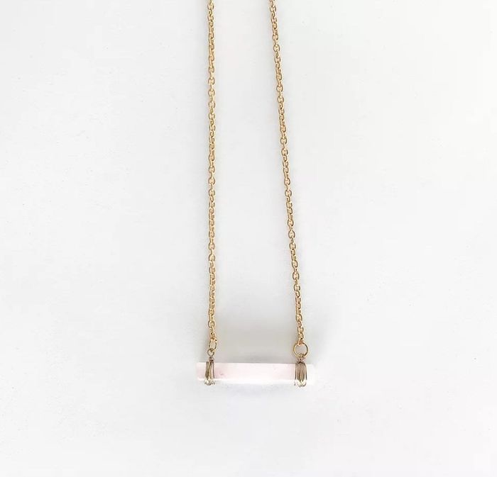 the rose quartz pendant necklace with a delicate gold chain