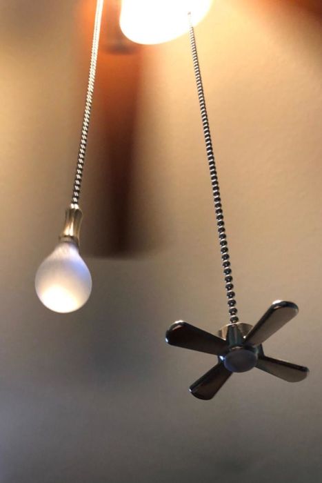 A close-up of the ceiling fan and light bulb pull charms