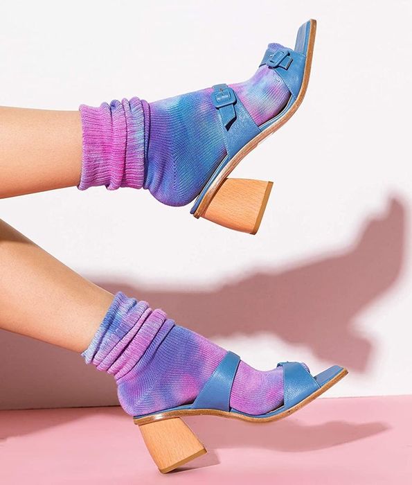 A model sporting purple and pink tie-dye socks paired with heeled sandals