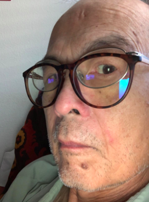 A reviewer seen wearing the blue-light-blocking glasses, enjoying their benefits.
