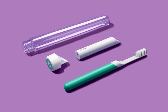 A photo showing the electric toothbrush and its components, giving a clear view of its parts and design.
