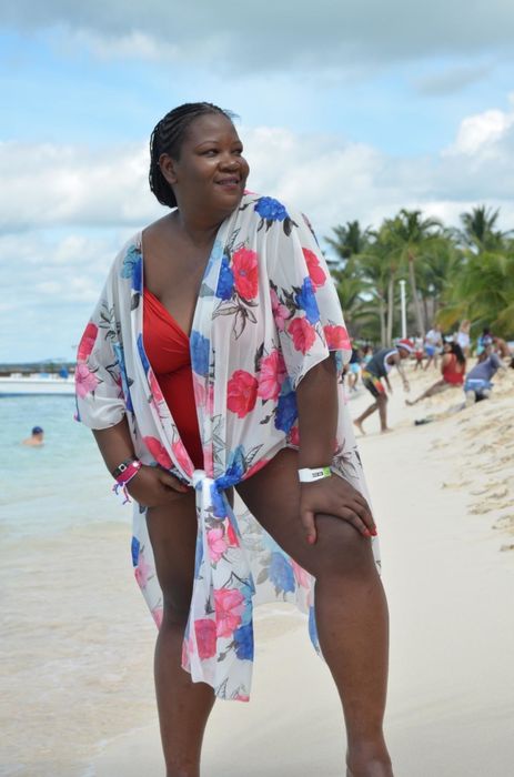 Reviewer using a cardigan as a beach cover-up