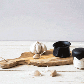 Model demonstrating the garlic crusher in a gif