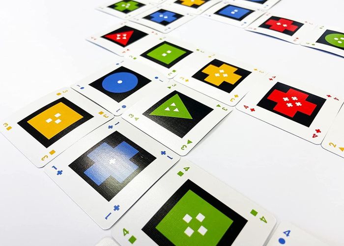The cards are spread out on the table.