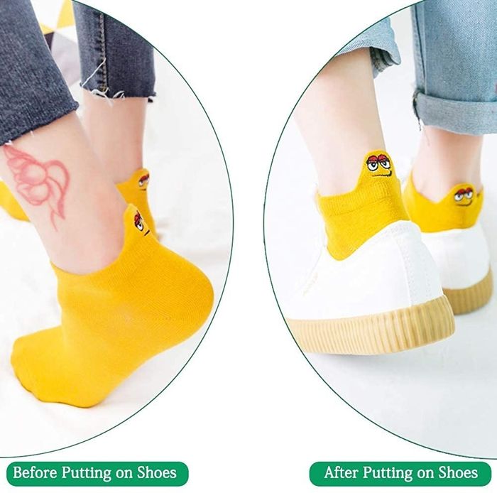 Socks featuring back tabs adorned with fun, Muppet-like character faces