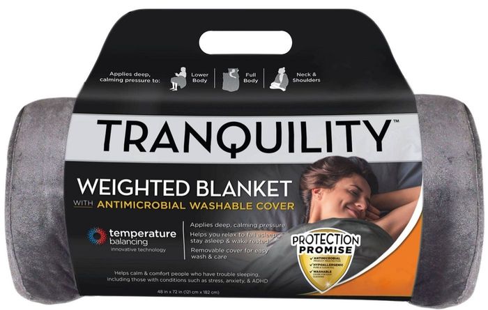 The blanket, which is a soothing shade of gray.