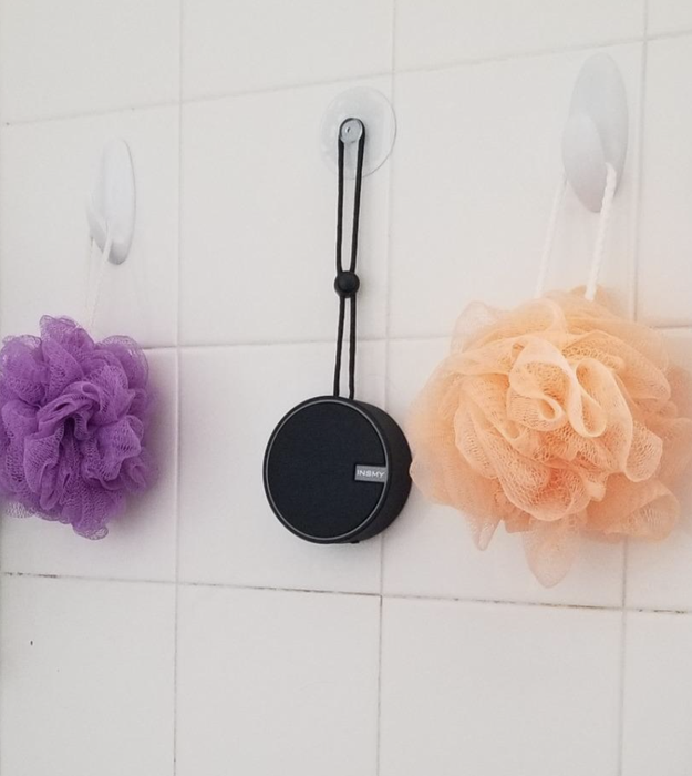A customer’s photo showcasing their Bluetooth speaker mounted in their shower, ready to play tunes.