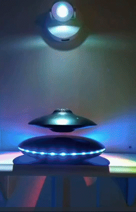 A floating silver magnetic spinner with LED lights, displayed as an intriguing ornamental gadget.