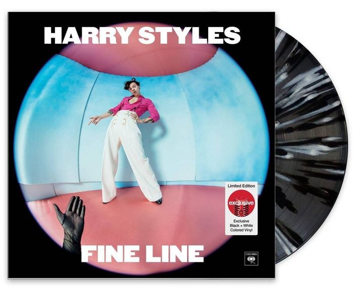 The album, featuring a vinyl with a striking black-and-white marbled design.