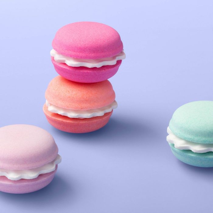 The bath bombs, which are designed to resemble small, pastel-colored macarons.