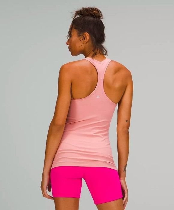 Model shown from the back in the pink racerback top