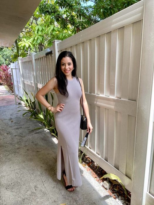 A reviewer mentions the light grey maxi dress.