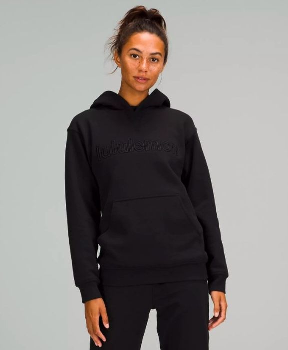 Model showing off the black hoodie