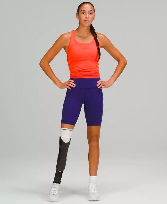 Model sporting the high-waisted shorts in purple