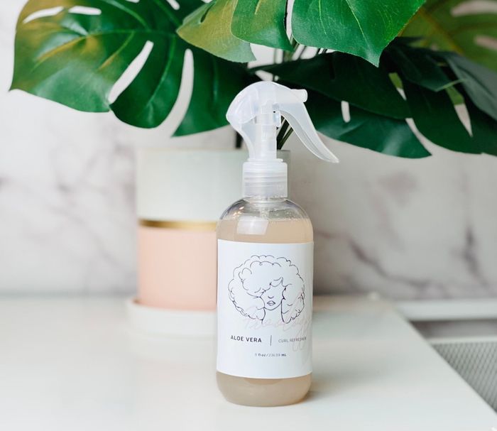 The bottle of curl refresher spray.