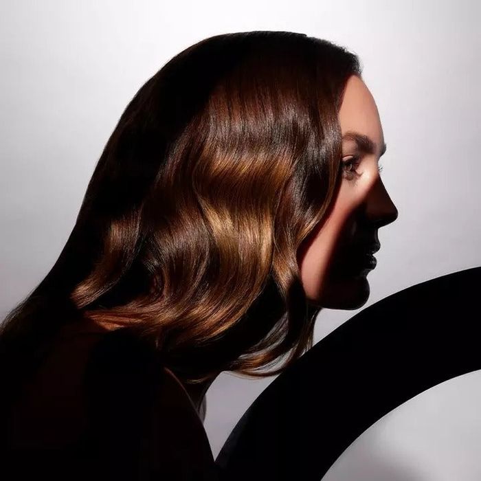 Side profile of a model showcasing silky, smooth hair.