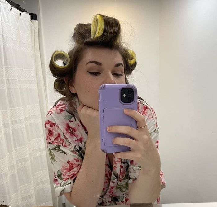 someone using Velcro hair rollers
