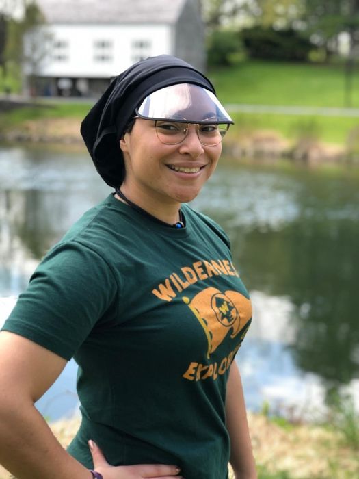 A person rocking the chic satin-lined waterproof hat.