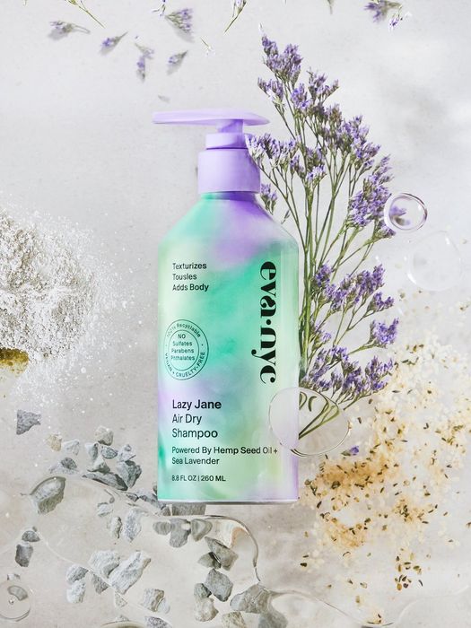 A green and purple shampoo bottle