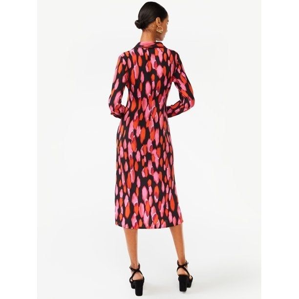 model wearing the dress in the pink brush dot pattern