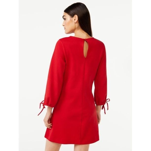 model showcasing the dress in red