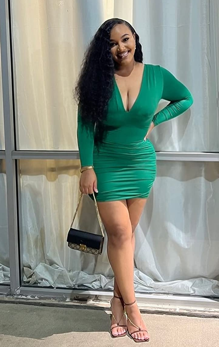 A reviewer rocking the dress in a beautiful green shade