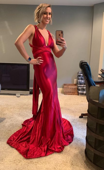 A reviewer showcasing the dress in red.