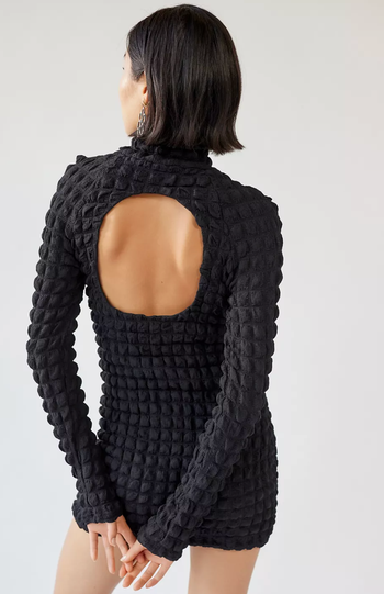 The back of the dress featuring a keyhole cutout design