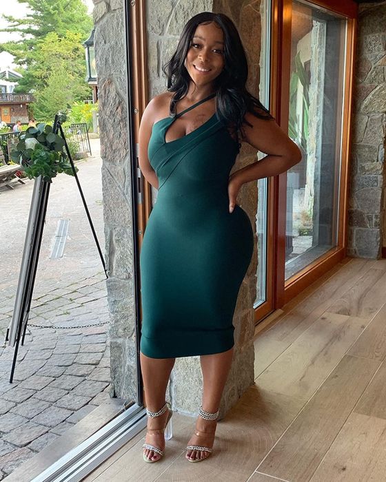 A customer flaunting the dress in a beautiful green color.