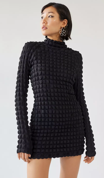 A model wearing the dress in a chic and stylish look