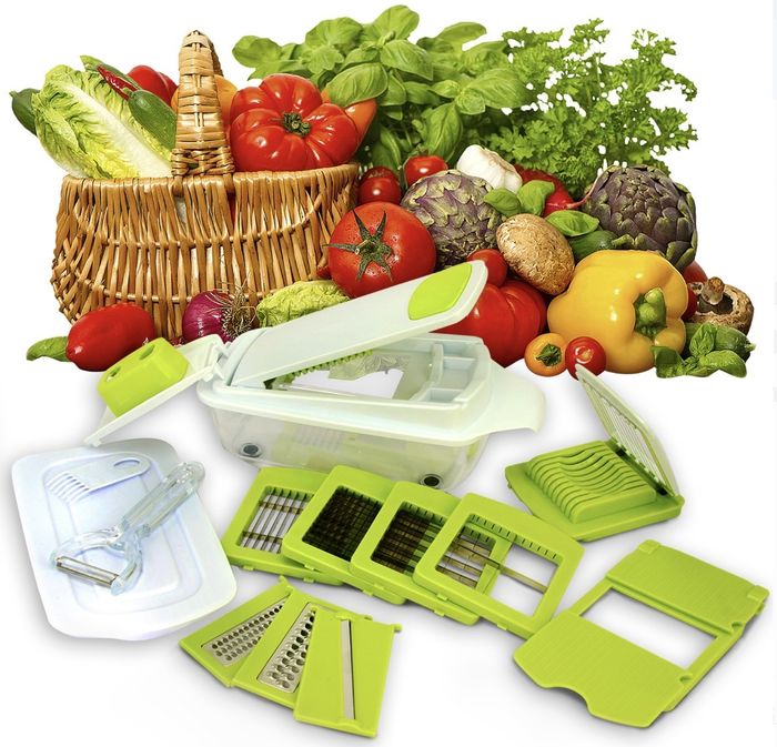 A set of green and white slicers with an assortment of vegetables filling the frame.