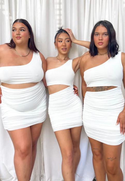 Three models showcasing the dress in different sizes.