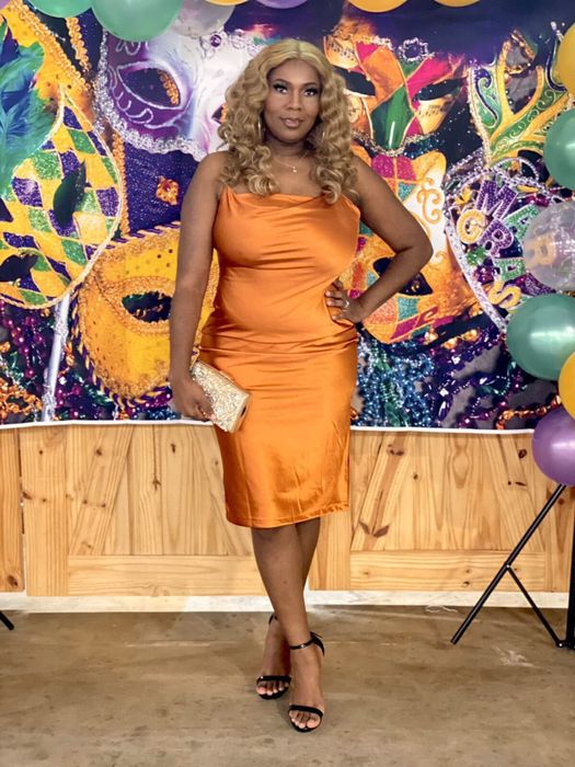 Reviewer wearing the dress in orange.