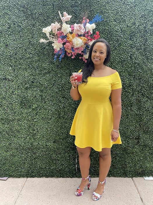 A reviewer rocking the dress in a bright yellow hue.