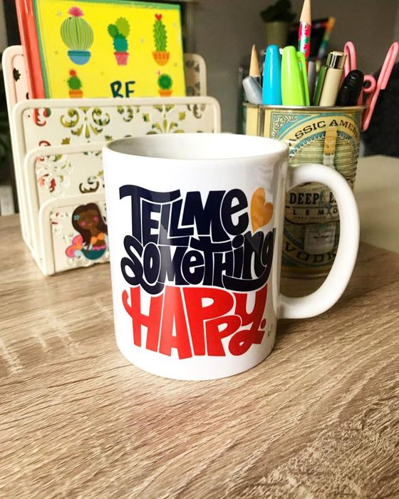 a white mug with a design that reads