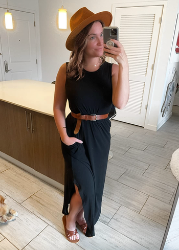 Reviewer wearing a black tank-style maxi dress.