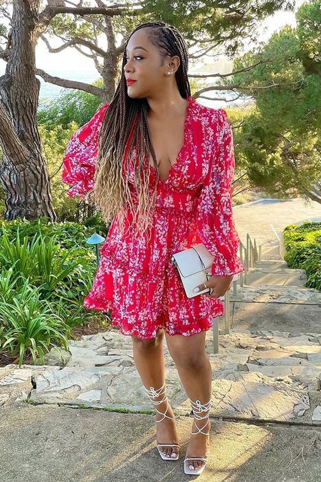 A customer submitted image showcasing the red floral dress