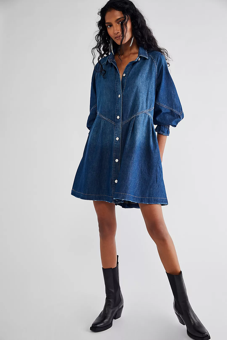Model wearing a button-up denim midi dress with 3/4 sleeves