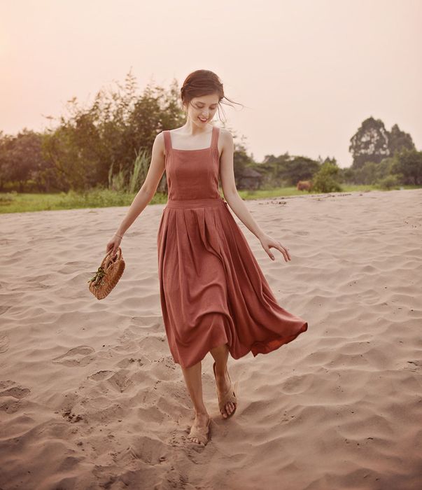 The model displaying the front view of the dress.