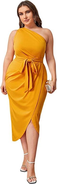 A model showcasing the dress in a vibrant mustard/yellow hue.