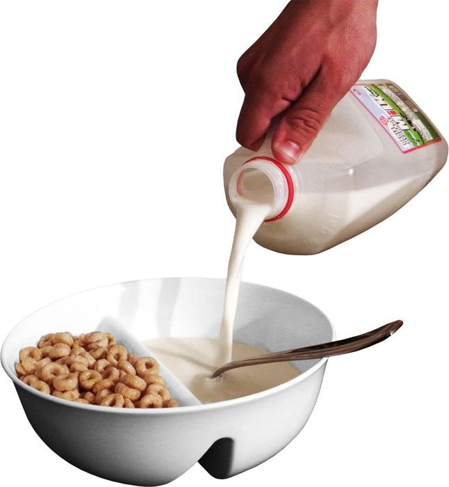 A neatly divided white bowl to keep the components of their cereal separated and crunchy for longer.