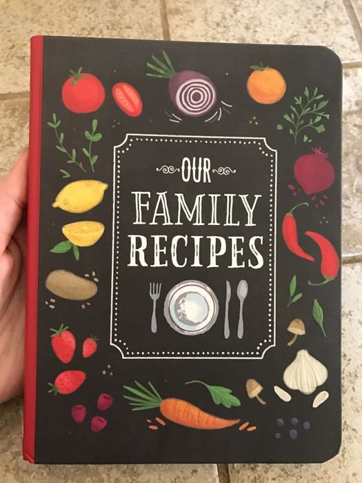 The front cover of the 'Our Family Recipes' book, ready to be filled with cherished family favorites.
