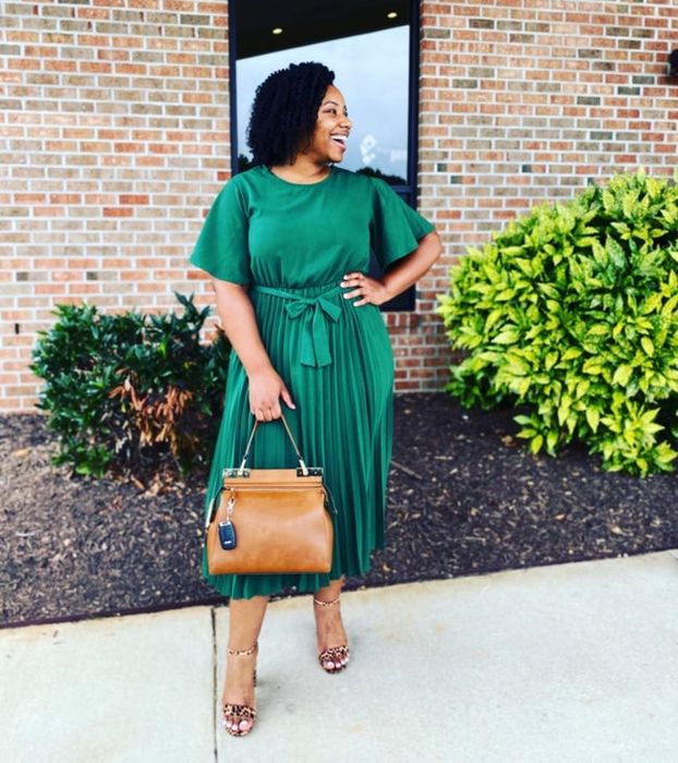 A photo submitted by a customer, proudly showcasing their green dress in action.