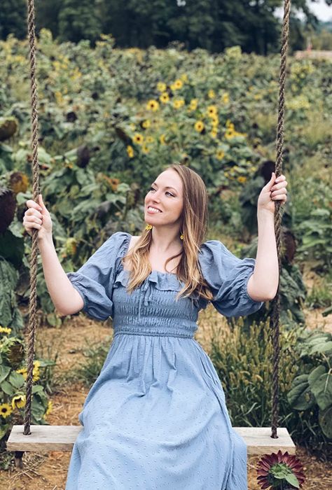 Another reviewer is seen wearing the dress with sleeves pulled up and styled in a refreshing blue hue.