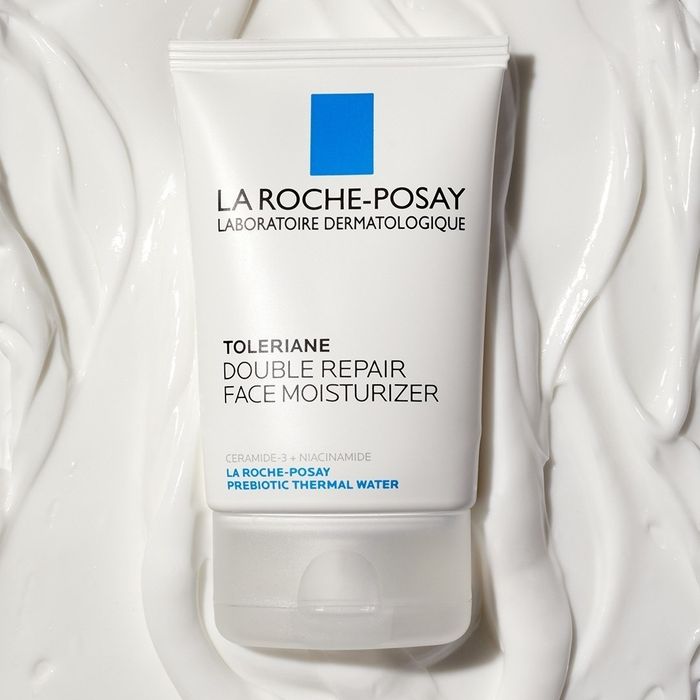 The moisturizer bottle and its formula are displayed to highlight the cream's texture and consistency.