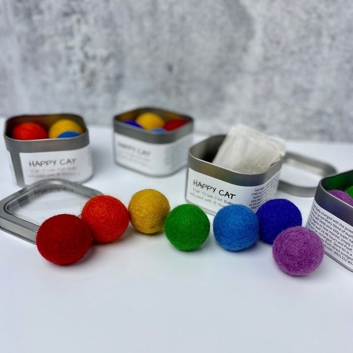 a variety of catnip balls in different colors arranged neatly