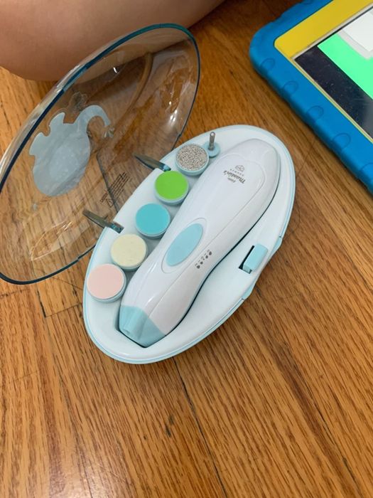 A reviewer's image of the baby nail clippers set complete with attachments