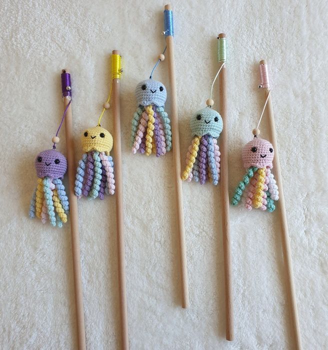 a set of five cat teasers in different vibrant colors